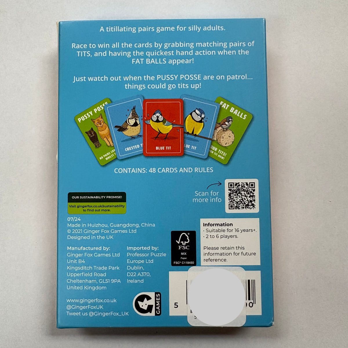 Back of the packaging for Ginger Fox Games 'Calm Your Tits' adult card game, featuring a light blue background with product details, a barcode, and a small card illustration.