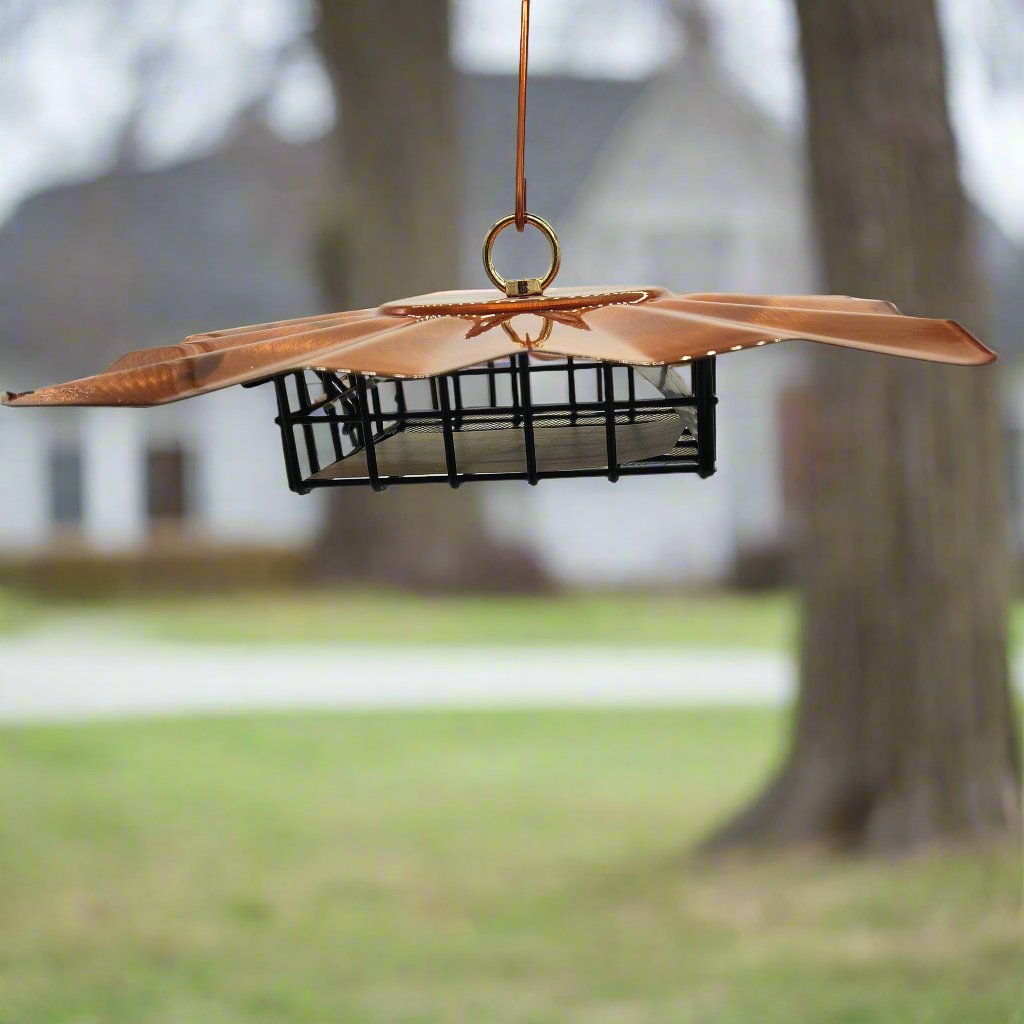 Copper roof on top of black wire basket