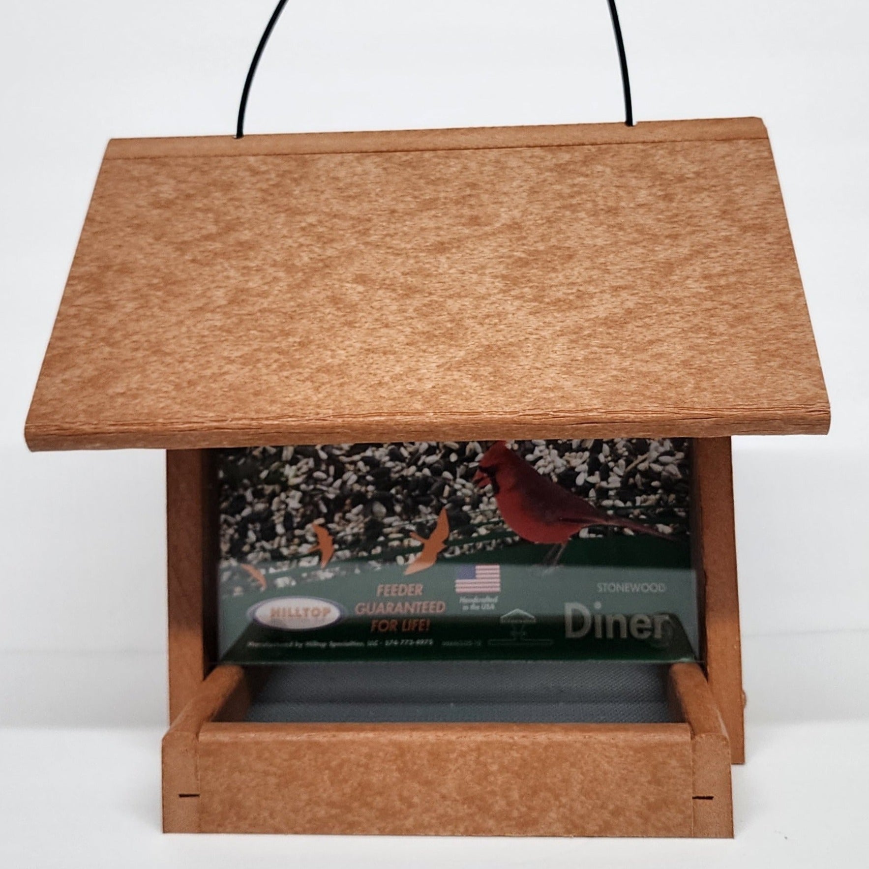 Tan colored bird feeder with silver screen base
