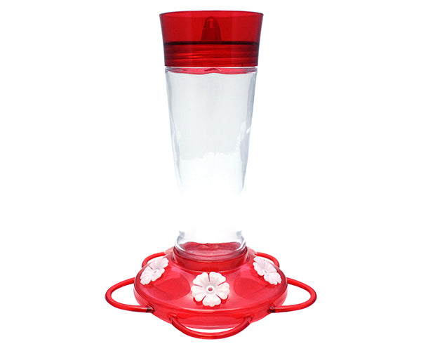 Glass hummingbird feeder with red top and base